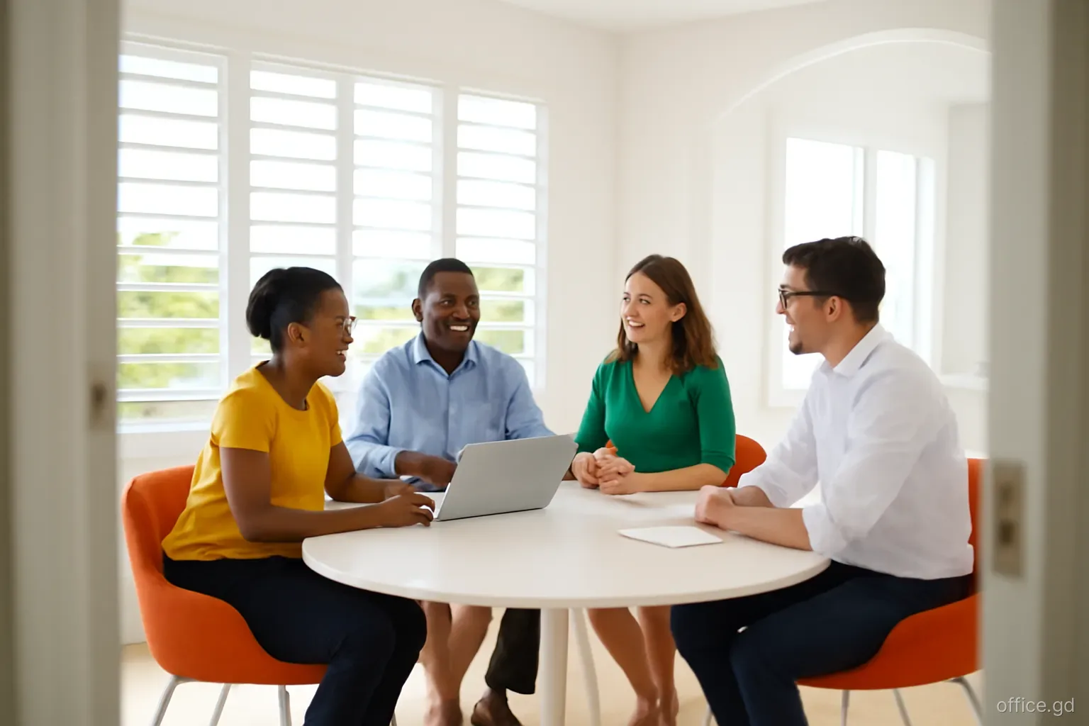 Small group of Grenadian and expatriate directors seated around a round table in an airy Grand Anse meeting room, wide angle from the doorway, sea glimpsed through louvred windows